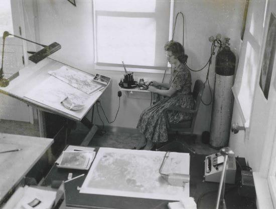A photo of Patricia Bridges at her drafting table (Courtesy of NGA).